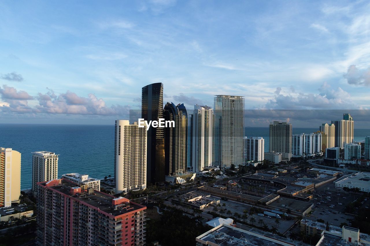 Modern buildings in city against sky