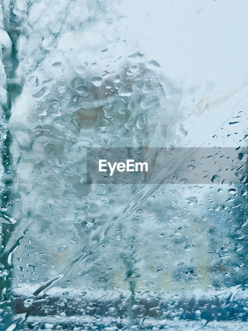 CLOSE-UP OF WATER DROPS ON WINDOW