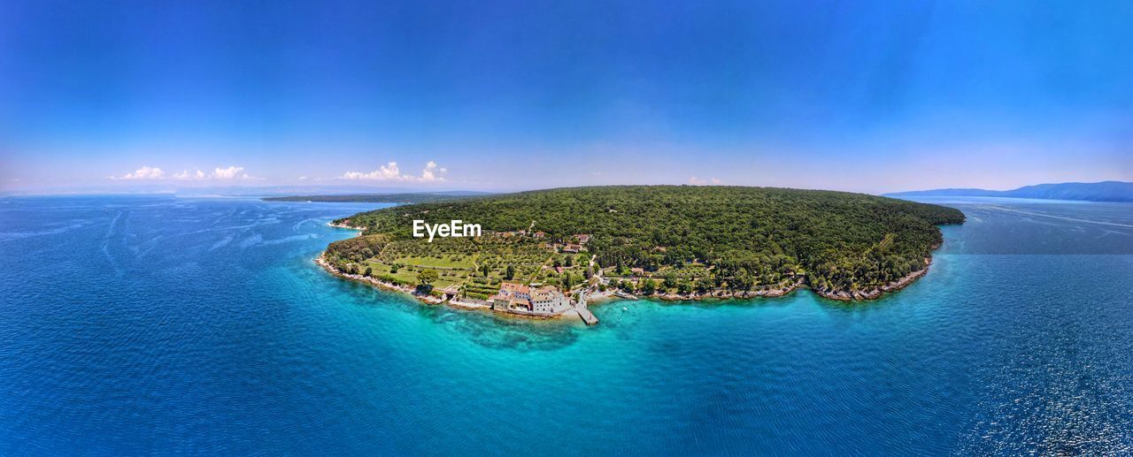 SCENIC VIEW OF ISLAND AGAINST SKY