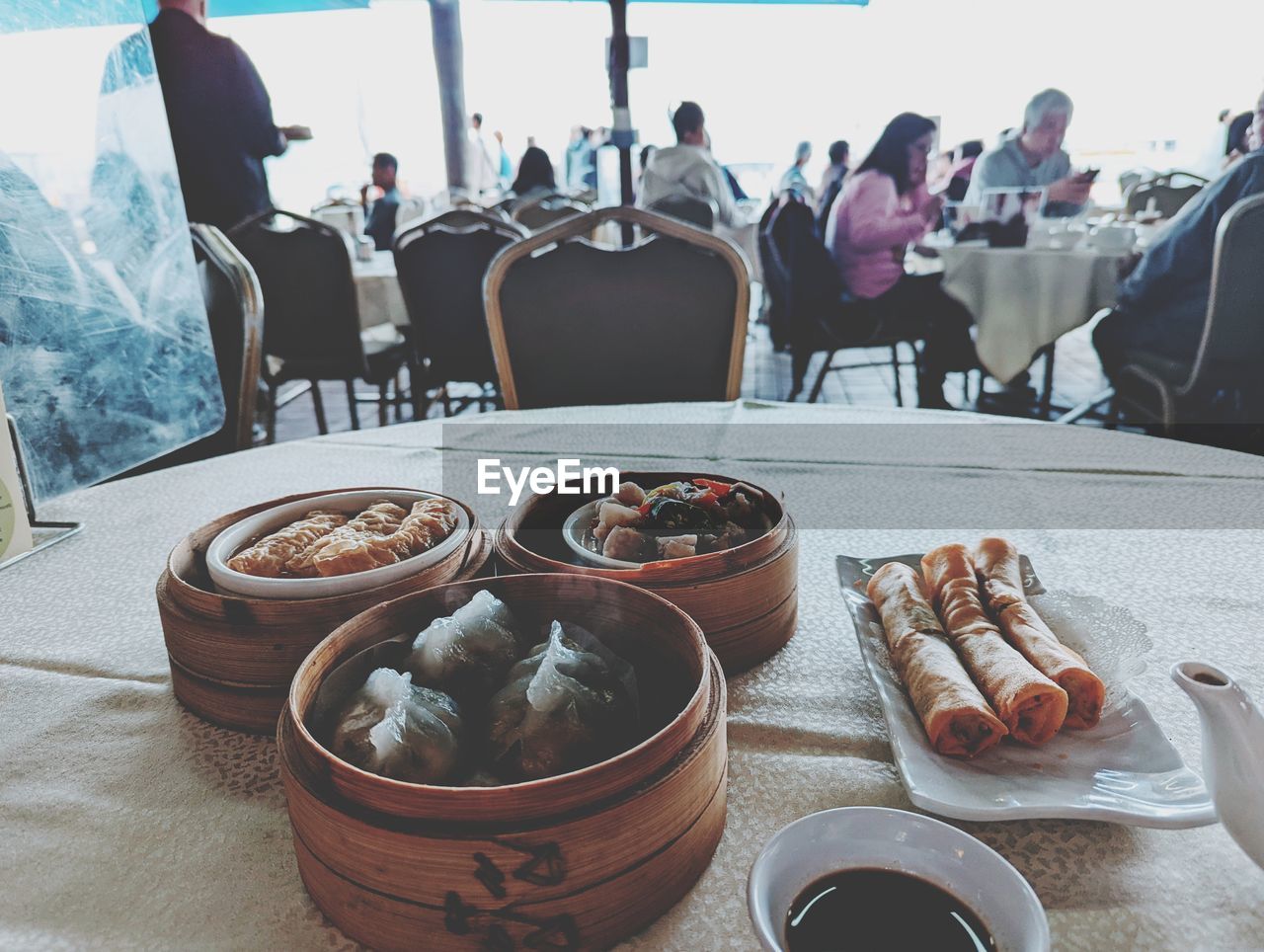 food and drink, food, table, meal, group of people, business, restaurant, indoors, adult, drink, day, women, men, freshness, person, chair, lunch