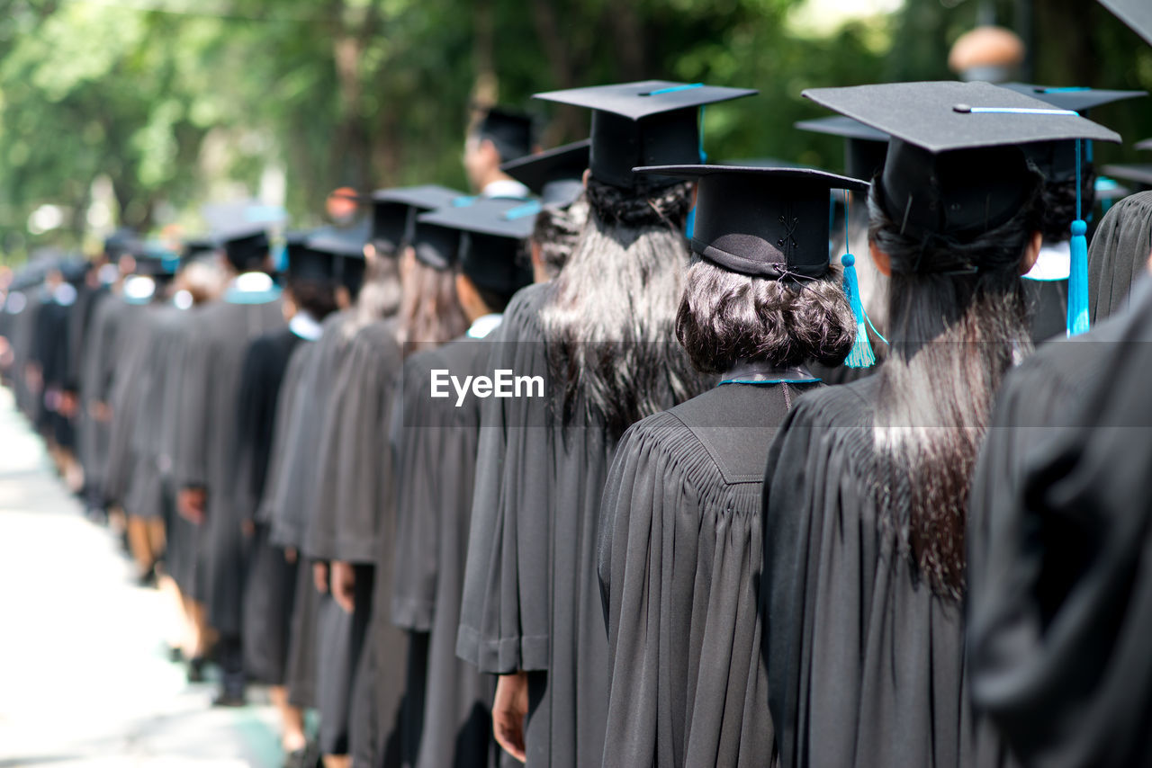 Rear view of people at graduation ceremony