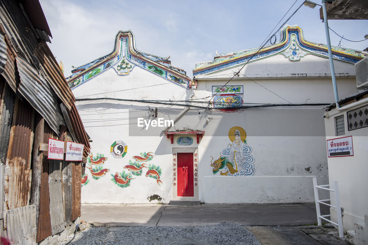 architecture, built structure, building exterior, town, building, street, urban area, city, no people, road, sky, nature, day, house, outdoors, tradition, cloud, history, religion, multi colored, travel destinations, neighbourhood, entrance