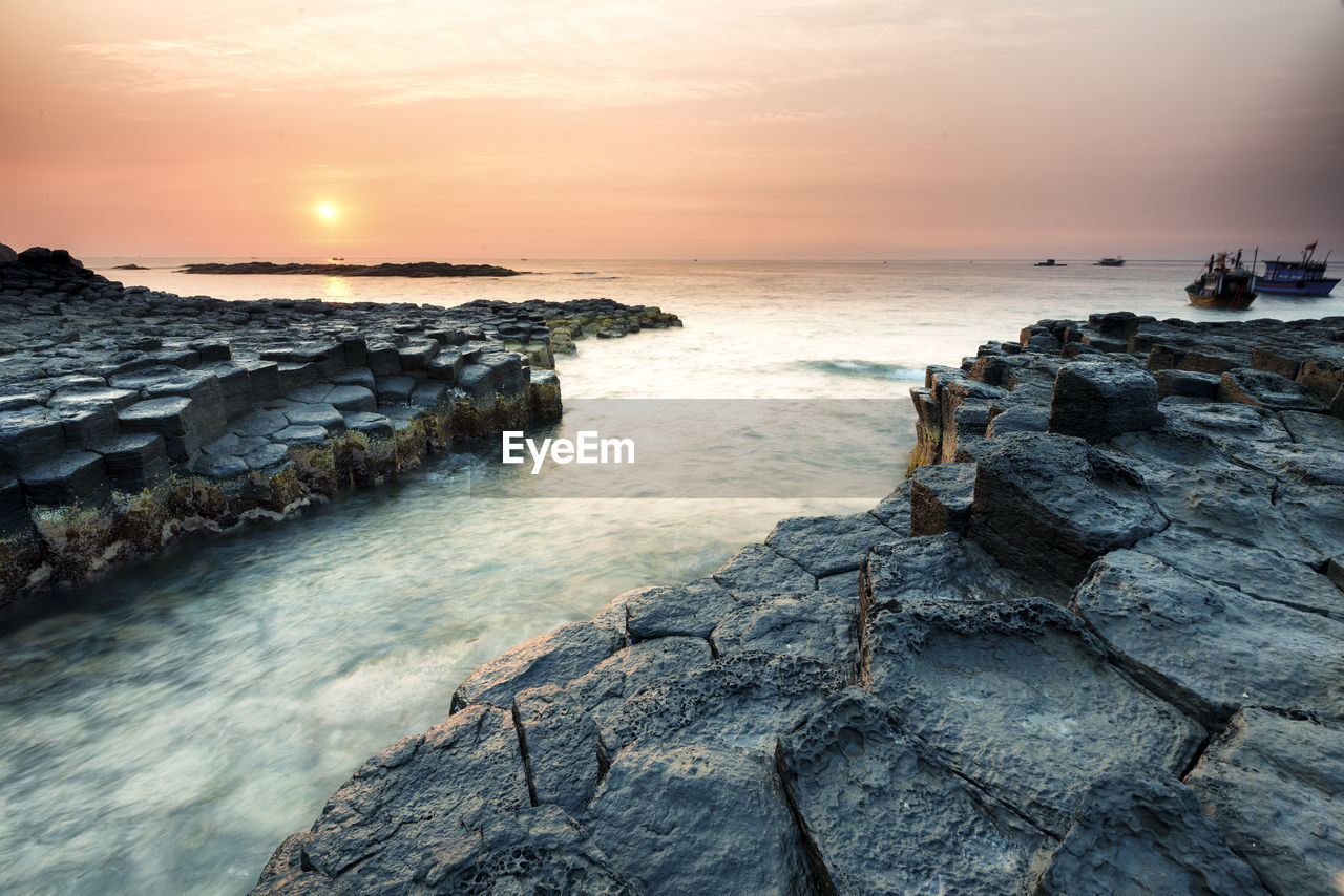 Scenic view of sea at sunset