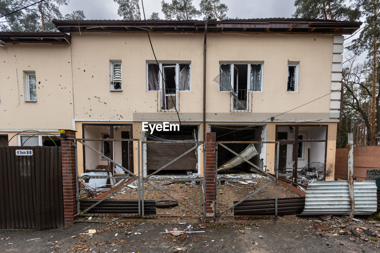 Destroyed buildings on the streets of irpen. broken windows. buildings after being hit by missiles.