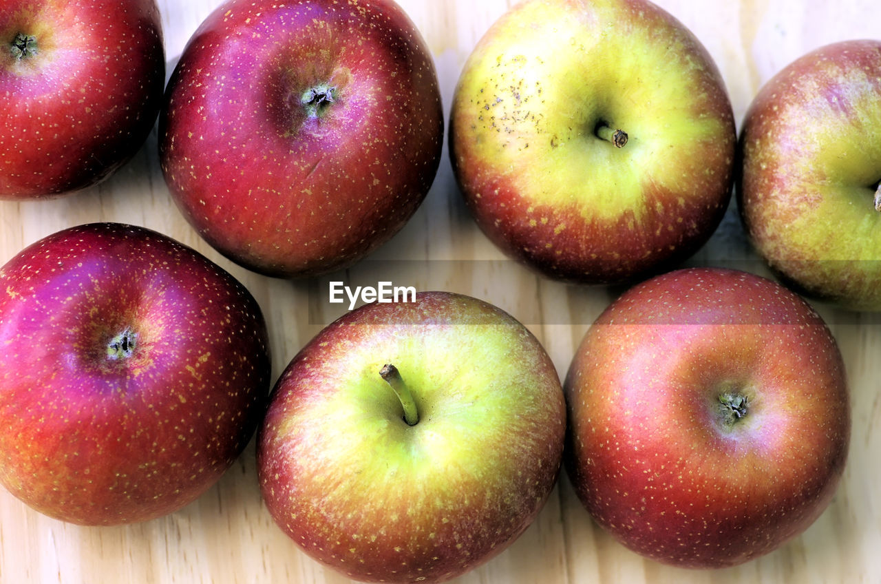 High angle view of apples on wooden table