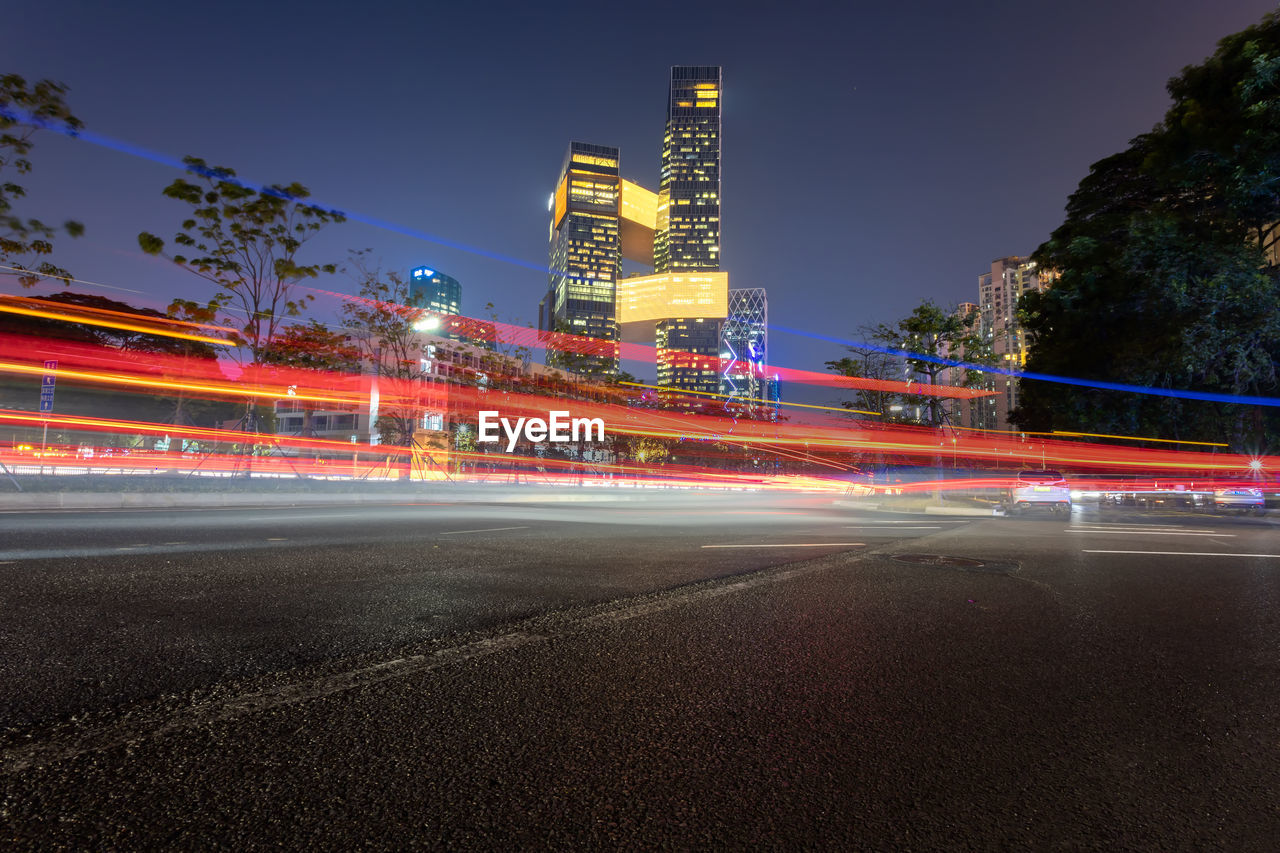 high angle view of light trails on highway at night