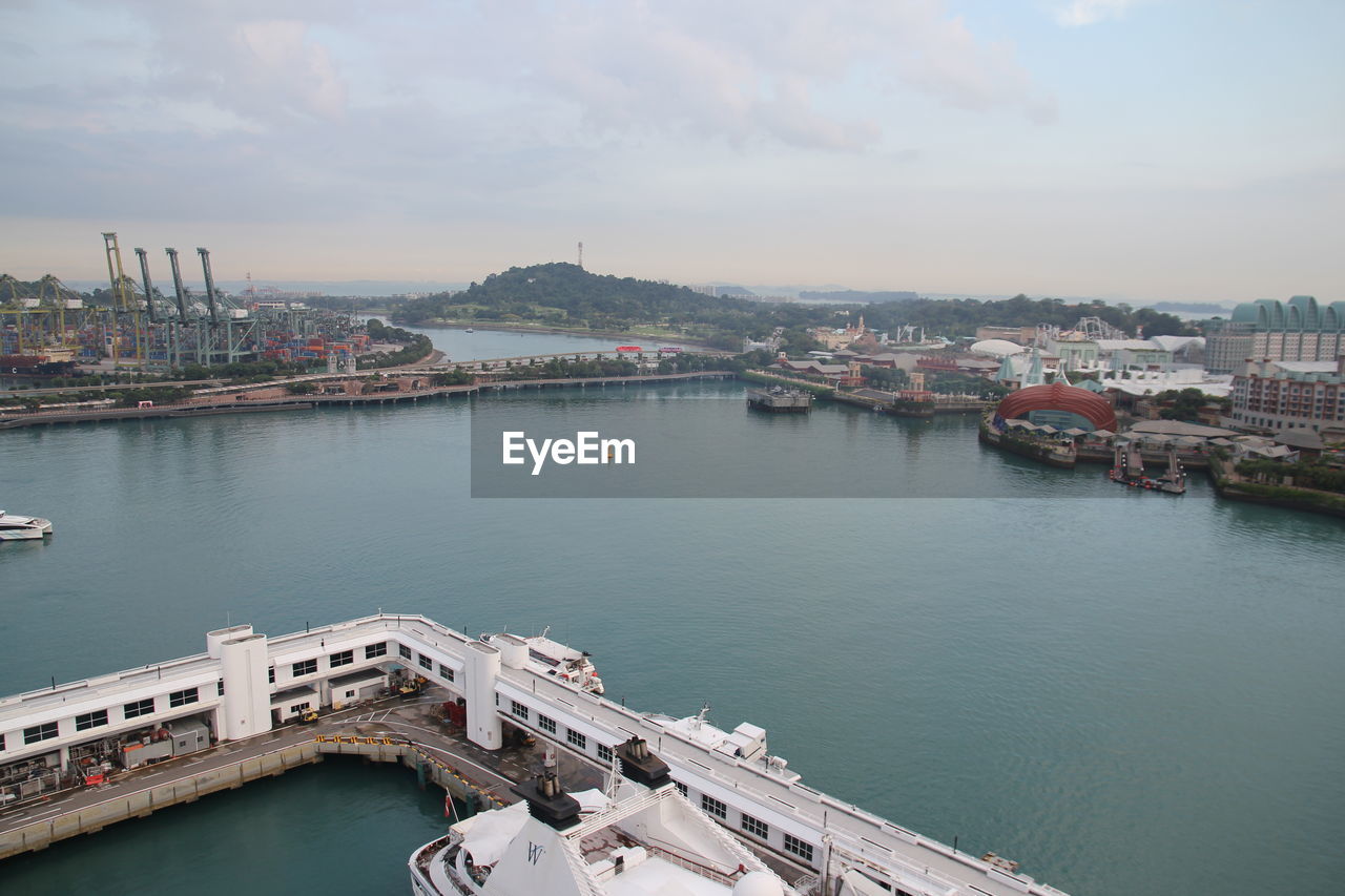 High angle view of bridge over river in city against sky