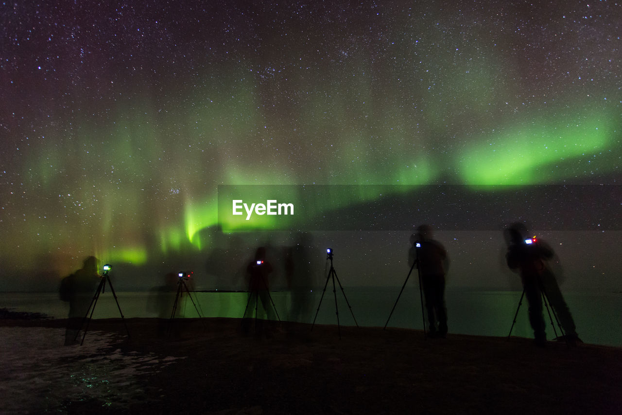 People photographing at night