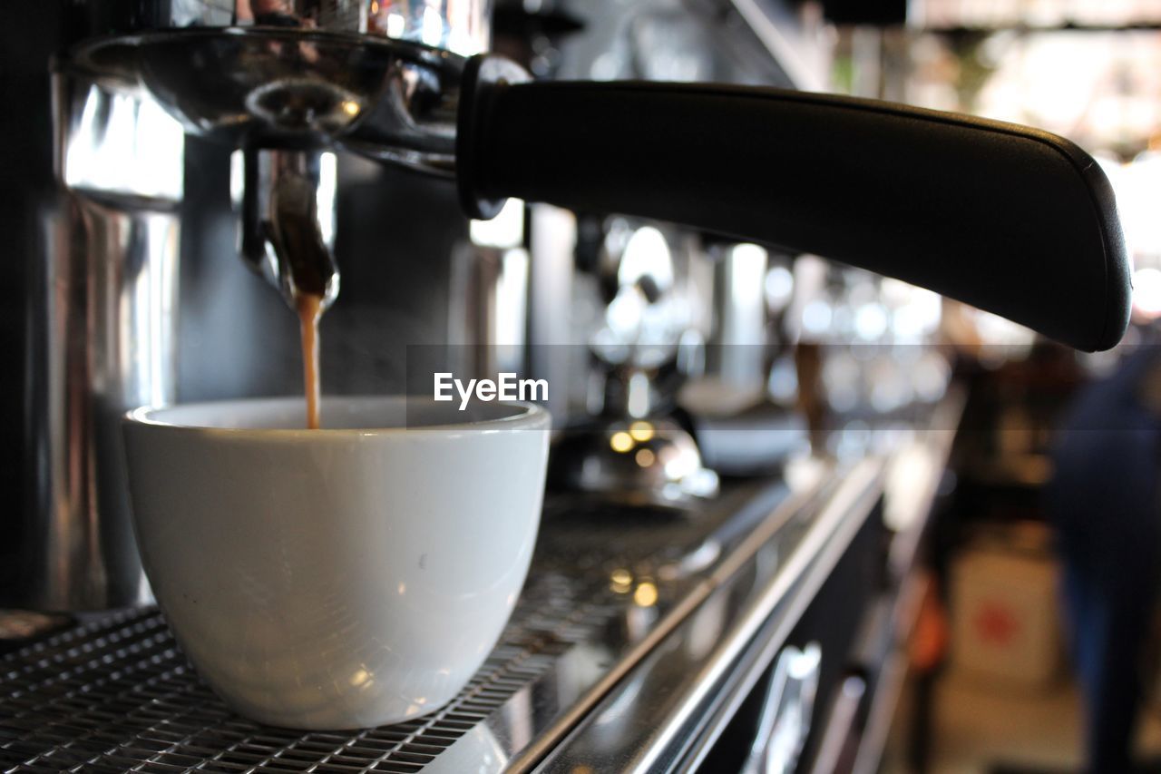 CLOSE-UP OF COFFEE SERVED IN KITCHEN