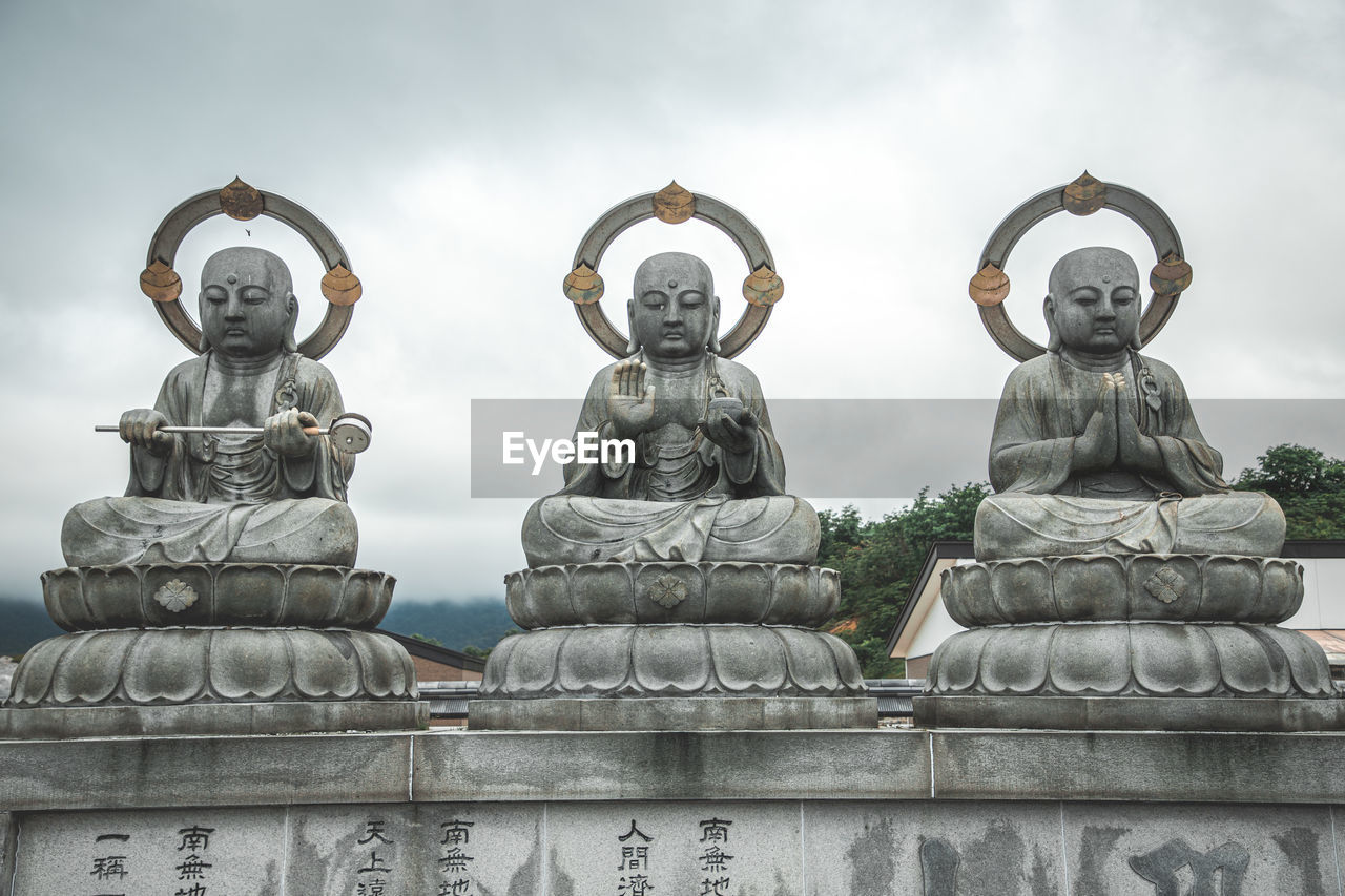 low angle view of statues