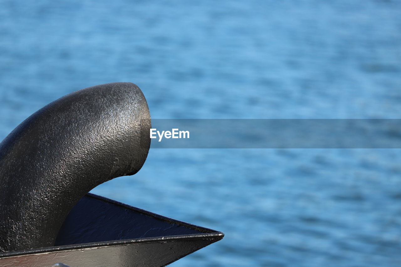 Boat exhaust funnel against sea.