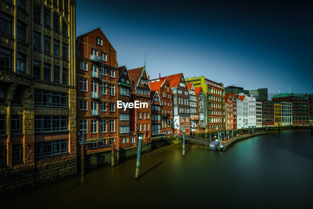 buildings in city against sky at night