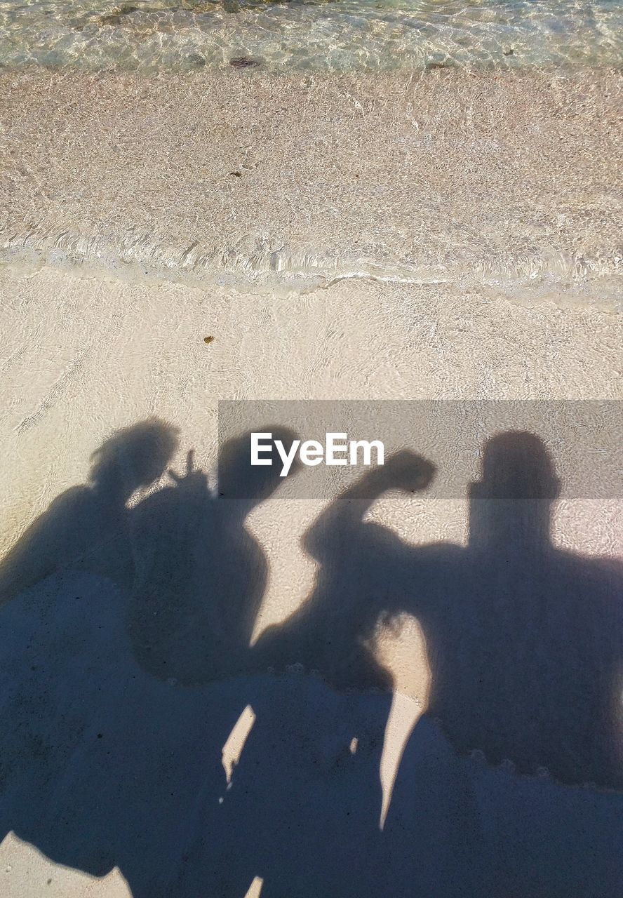 Shadow of people at beach