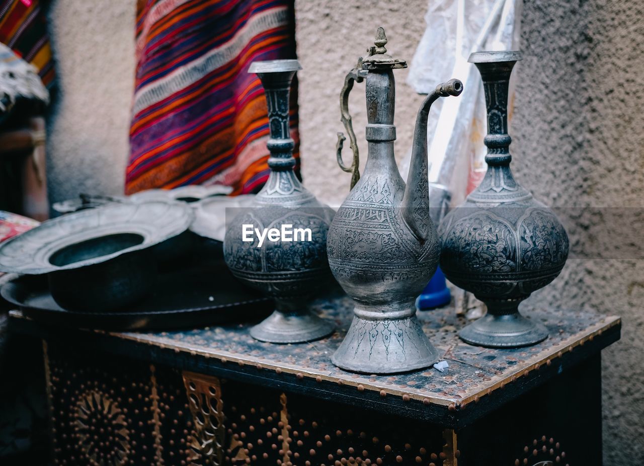 Close-up of antique utensils on table