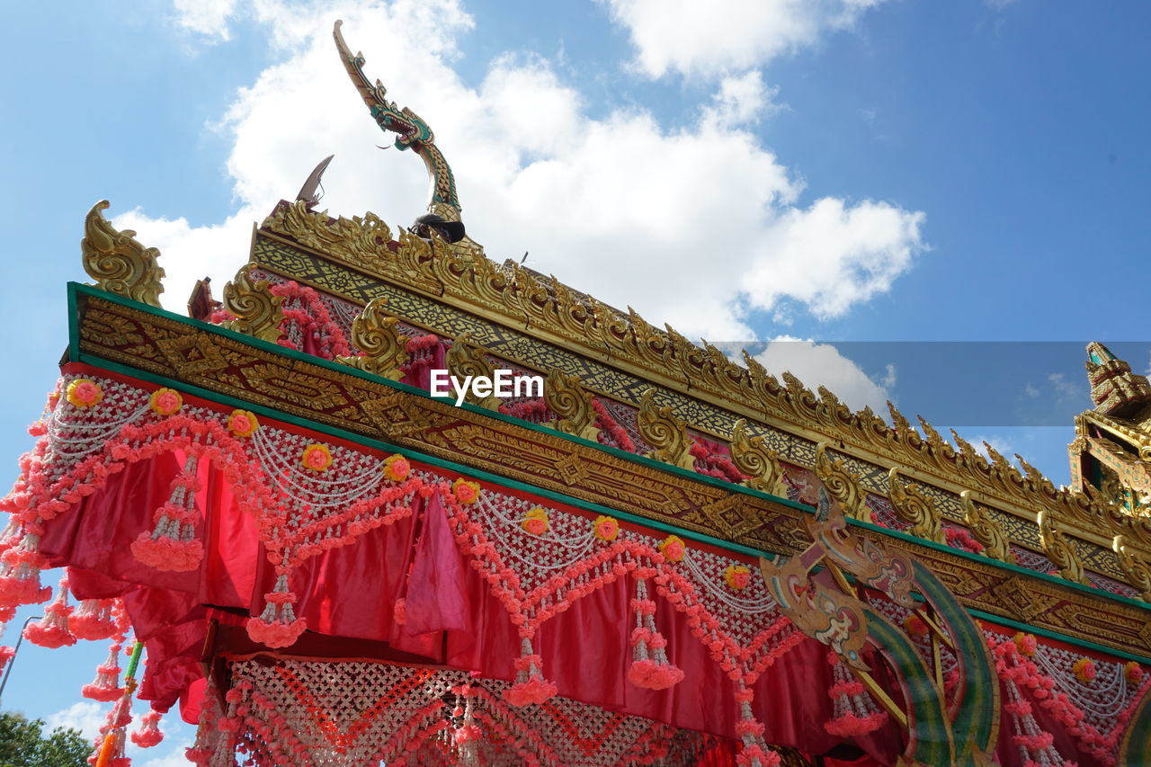 LOW ANGLE VIEW OF TEMPLE AGAINST BUILDING