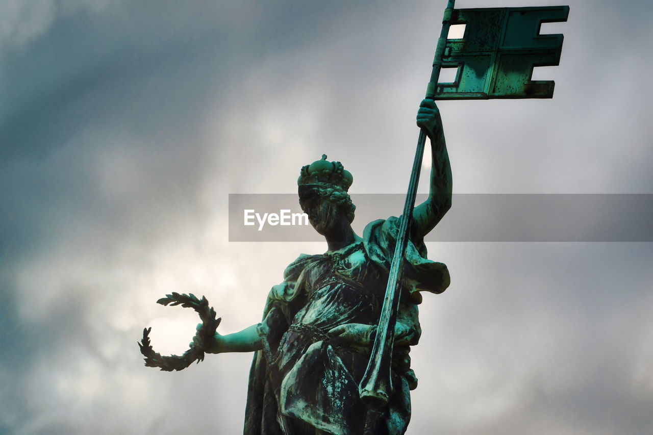 green, sky, blue, low angle view, cloud, nature, human representation, statue, sculpture, representation, outdoors, day