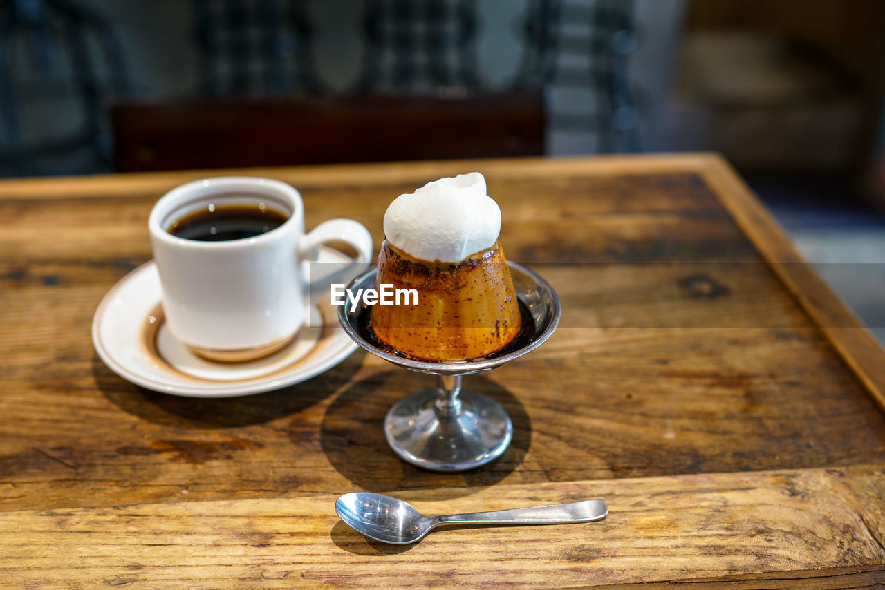 COFFEE CUP ON TABLE WITH TEA CUPS