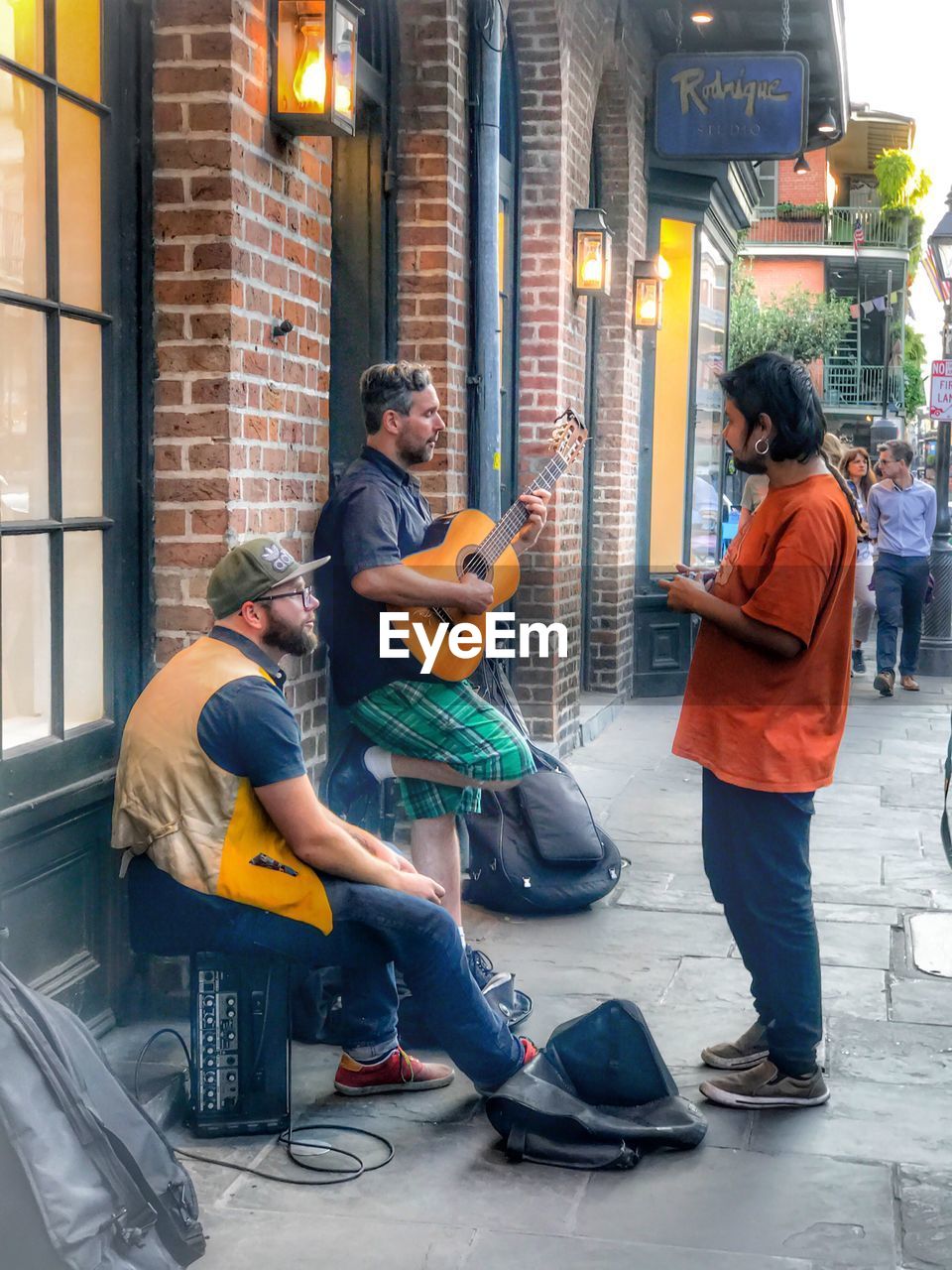 PEOPLE PLAYING GUITAR IN SHOPPING MALL