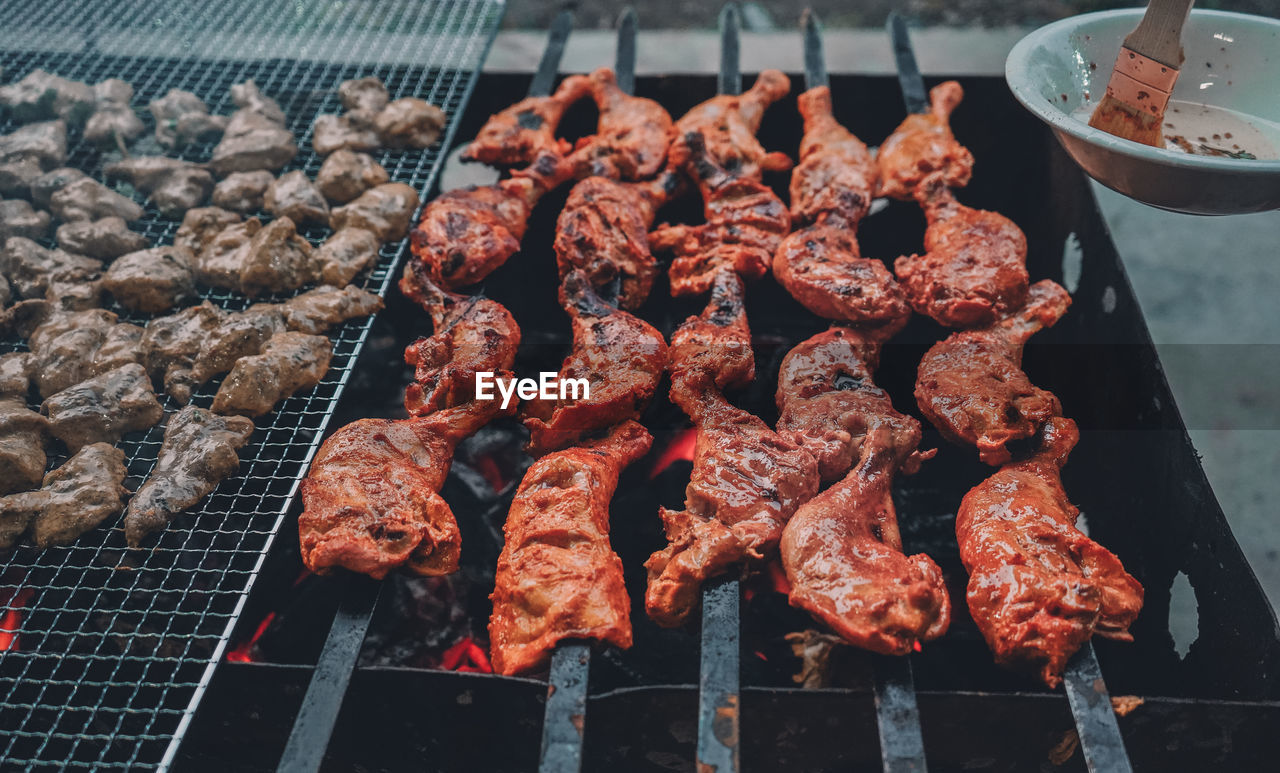 High angle view of meat on barbecue grill