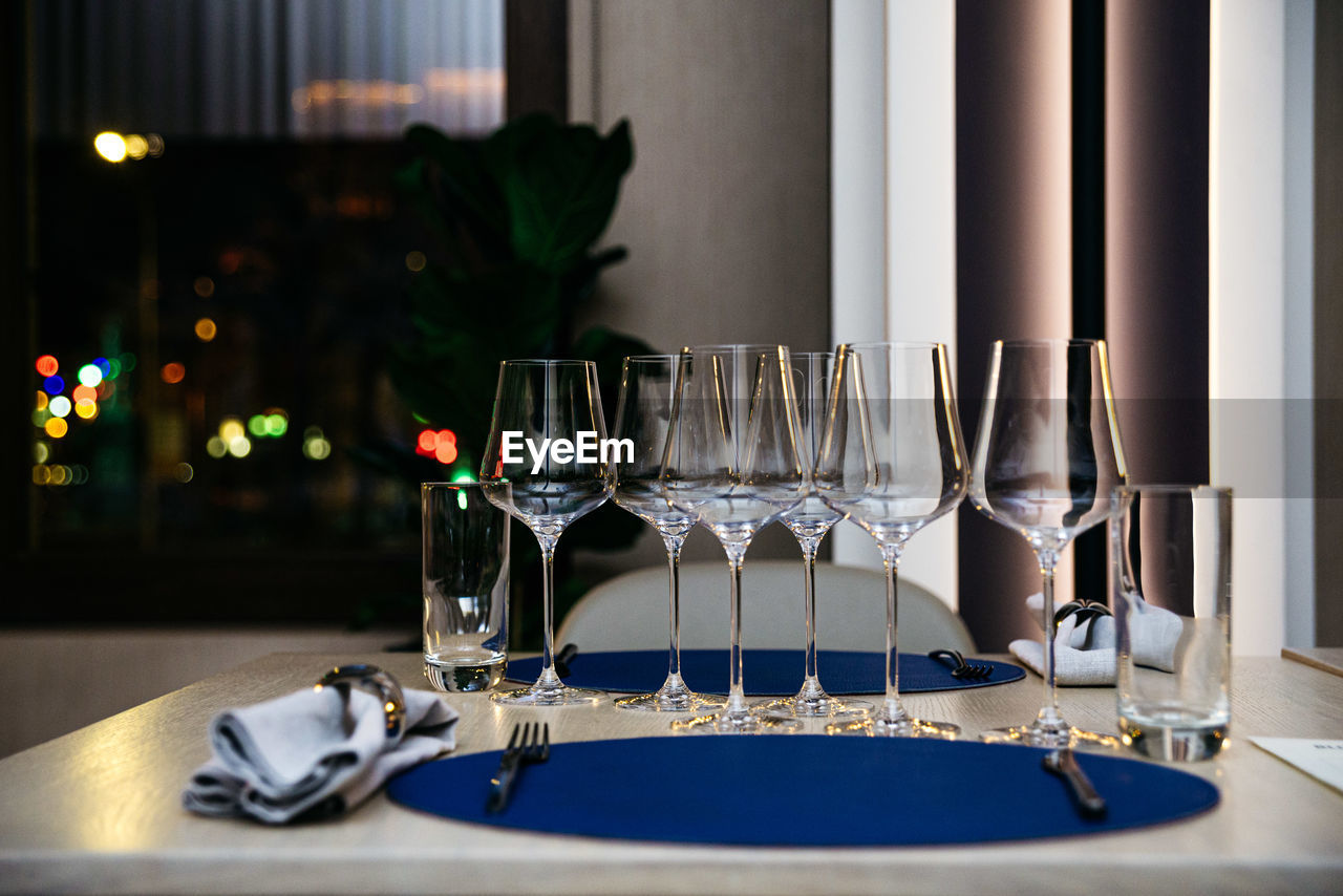 The table in the restaurant served according to the rules of etiquette. evening lights, interior