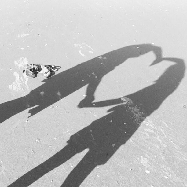 SHADOW OF WOMAN ON WALL