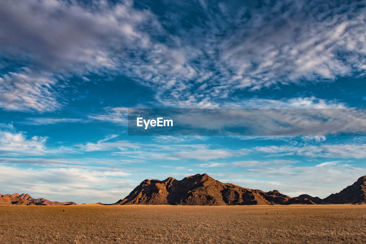 Scenic view of desert against sky