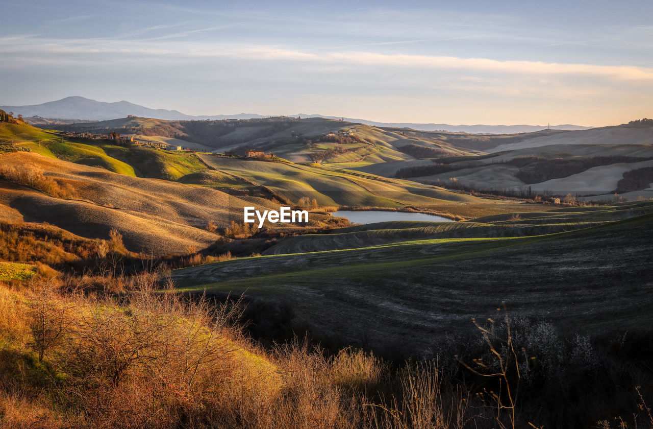 Scenic view of landscape against sky during sunset