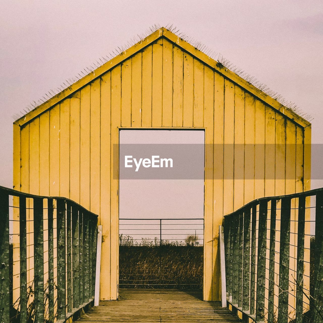 EXTERIOR OF BARN AGAINST SKY DURING AUTUMN