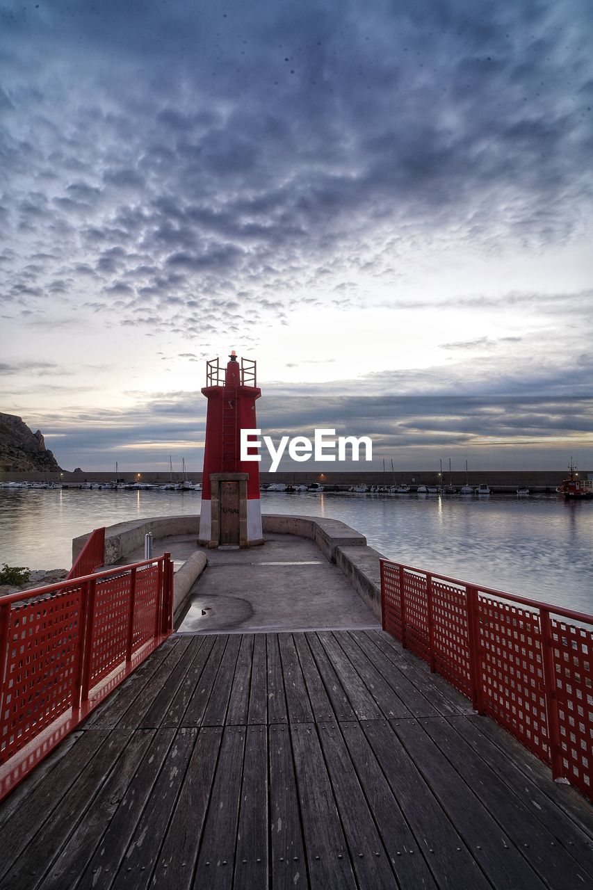 Pier over sea against sky