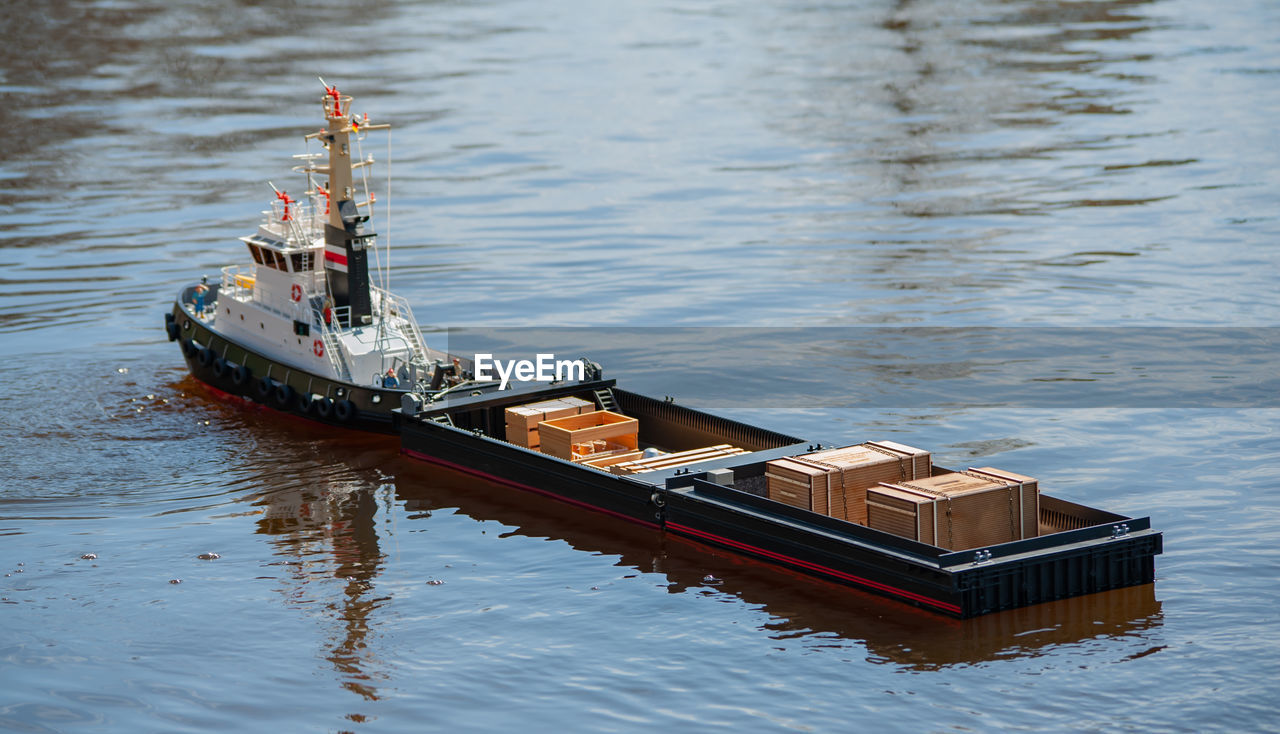 Remote controlled ship model is remote controlled on a lake