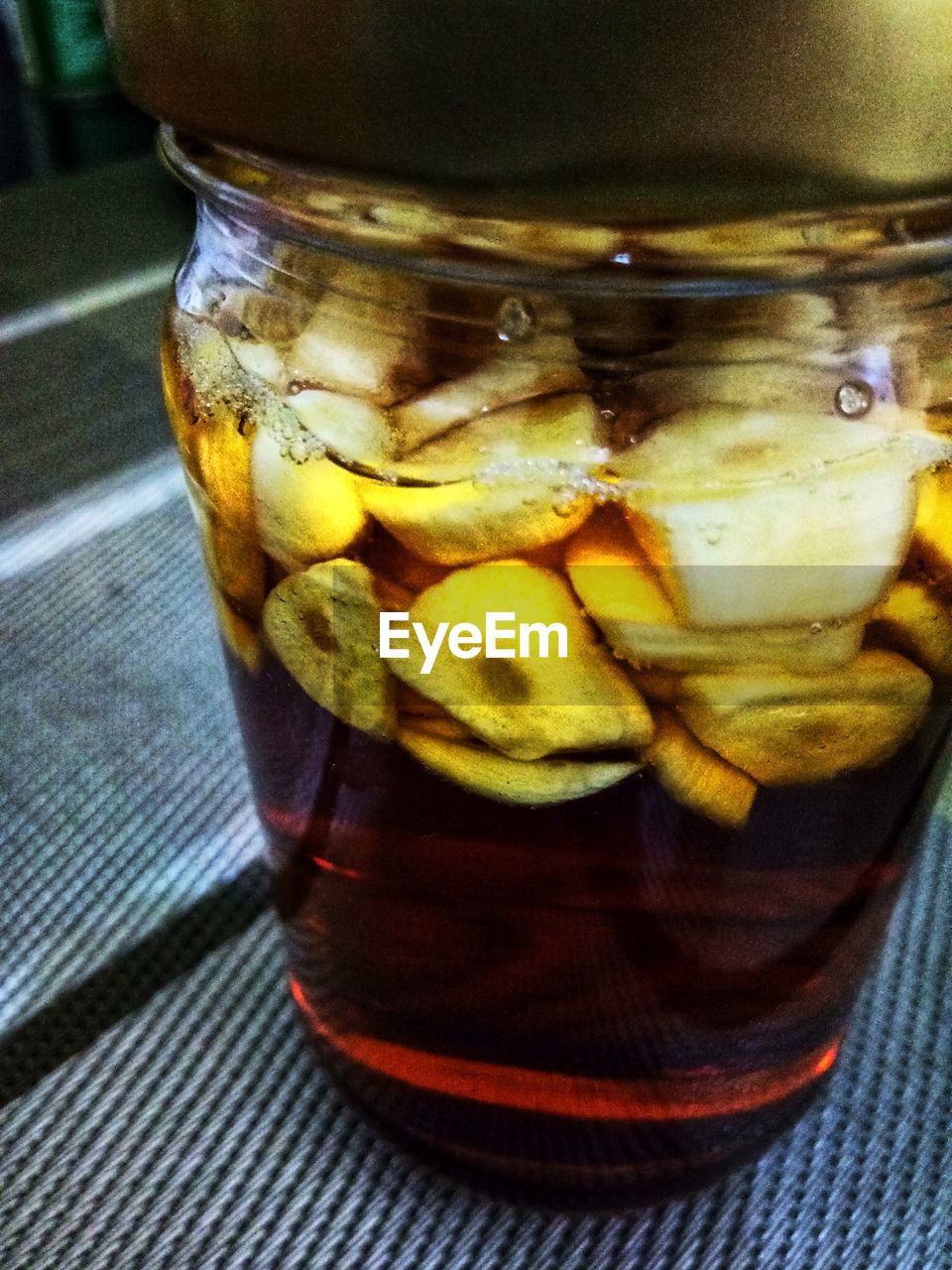 CLOSE-UP OF DRINK IN GLASS JAR ON TABLE