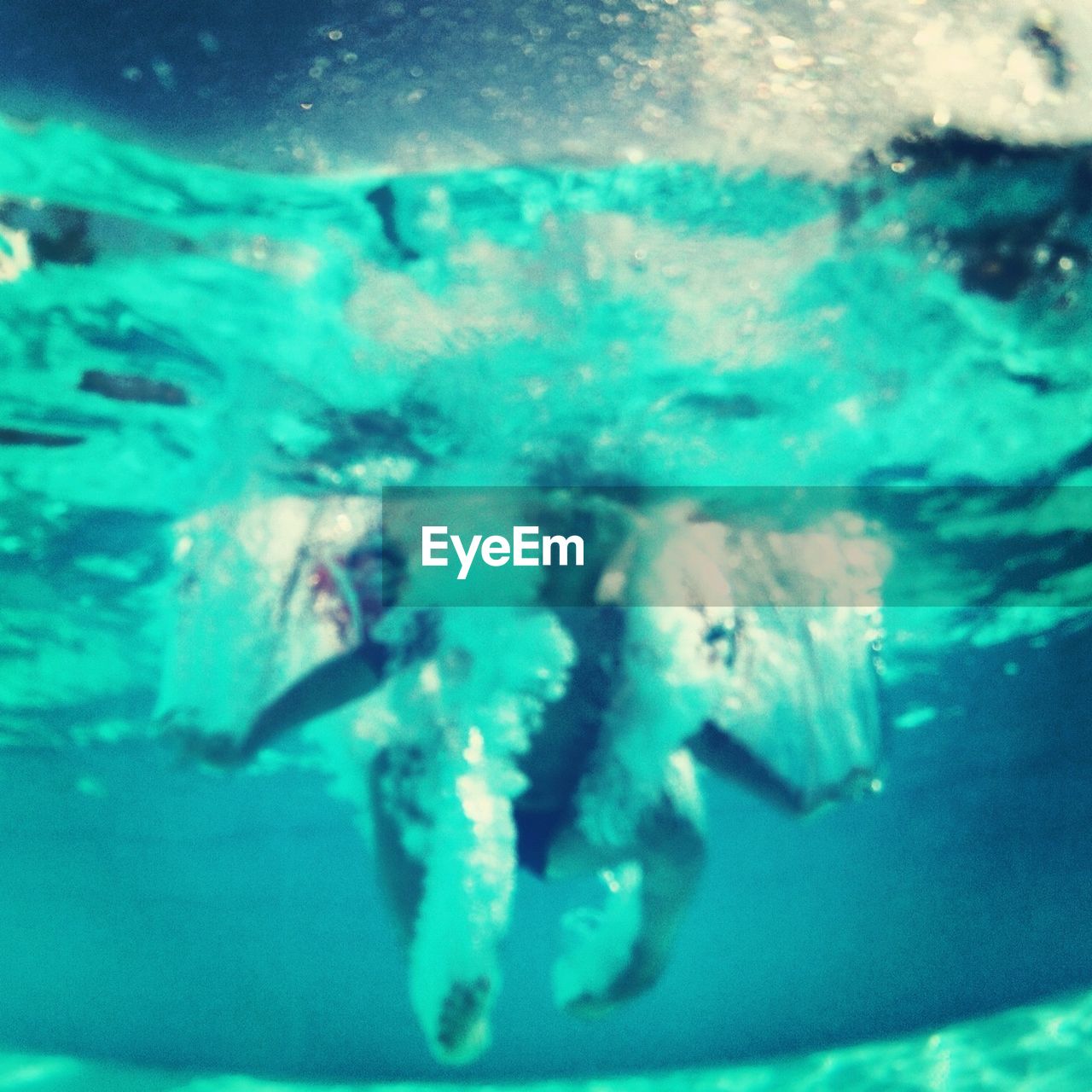 Low angle view of person swimming underwater