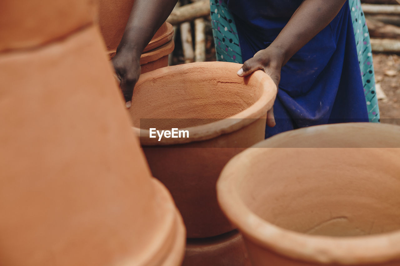 African woman holding pot