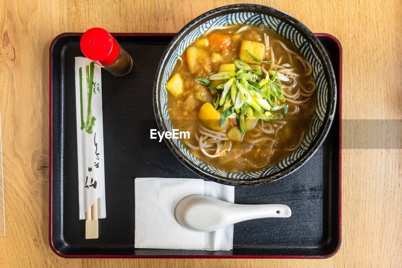 DIRECTLY ABOVE SHOT OF SOUP WITH VEGETABLES IN BOWL