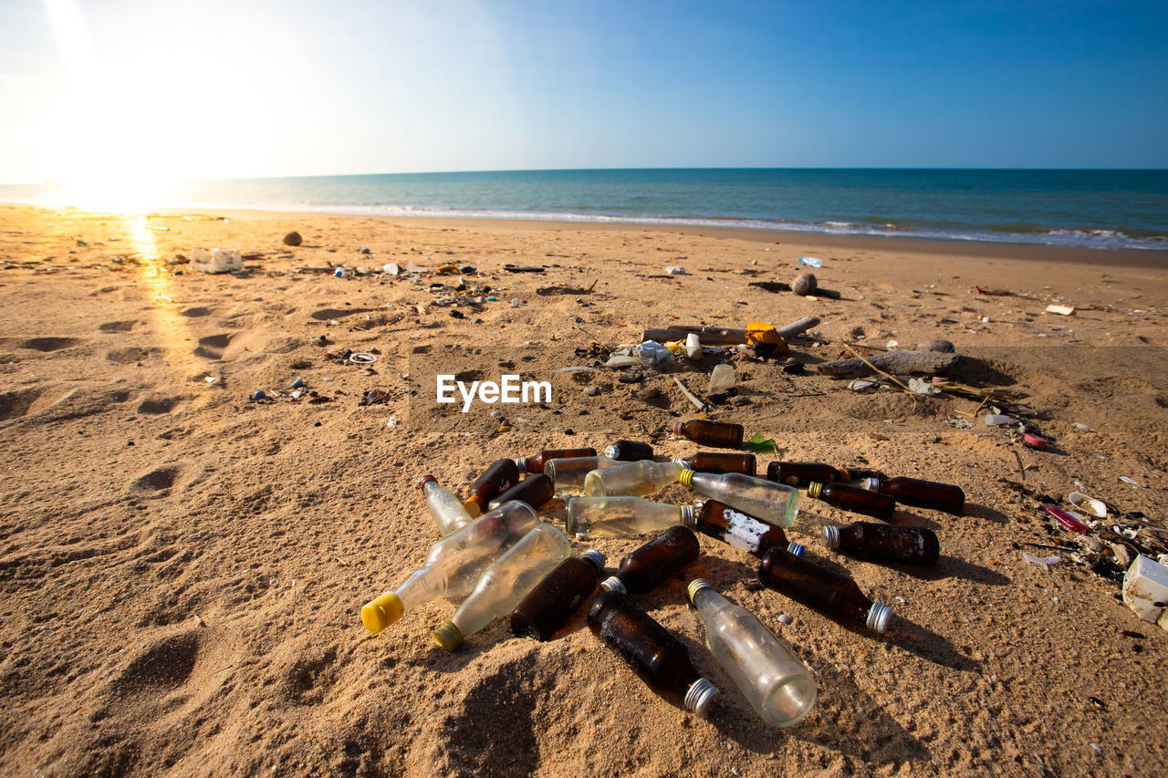VIEW OF GARBAGE ON BEACH