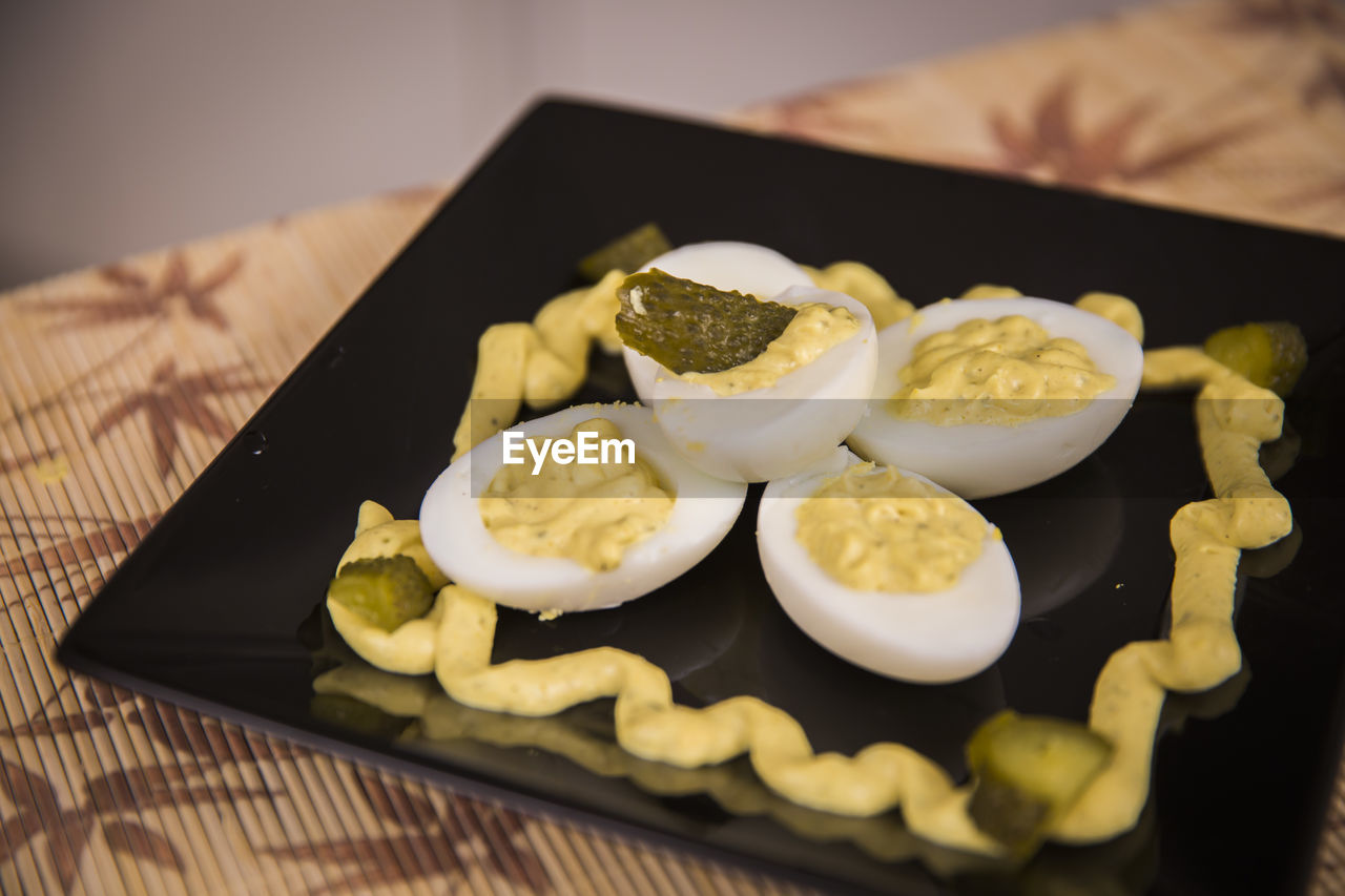 Close-up of eggs served in plate on table