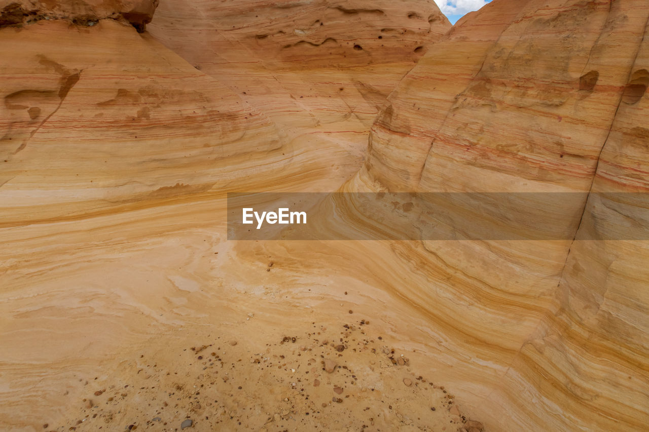 Close up of swirling yellow striped rock formations at ojito wilderness in new mexico