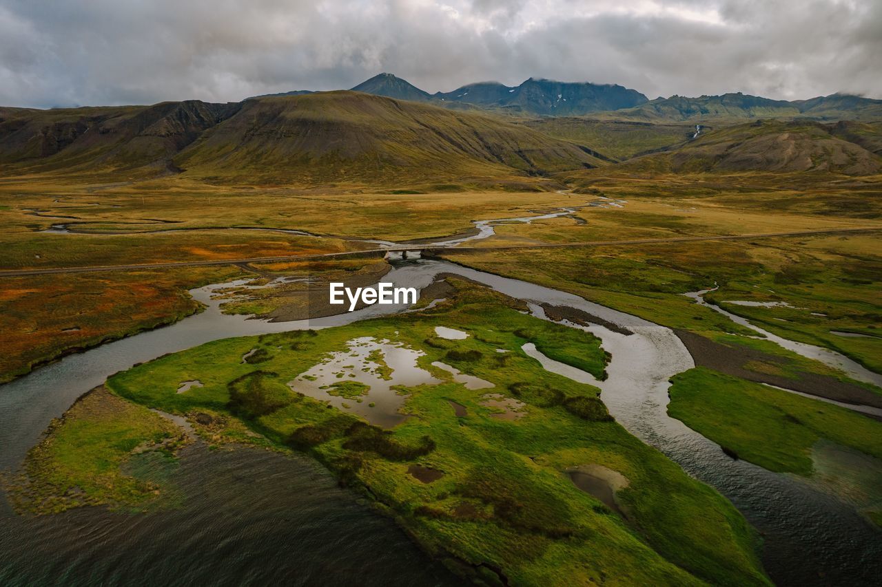 scenic view of landscape and mountains against sky