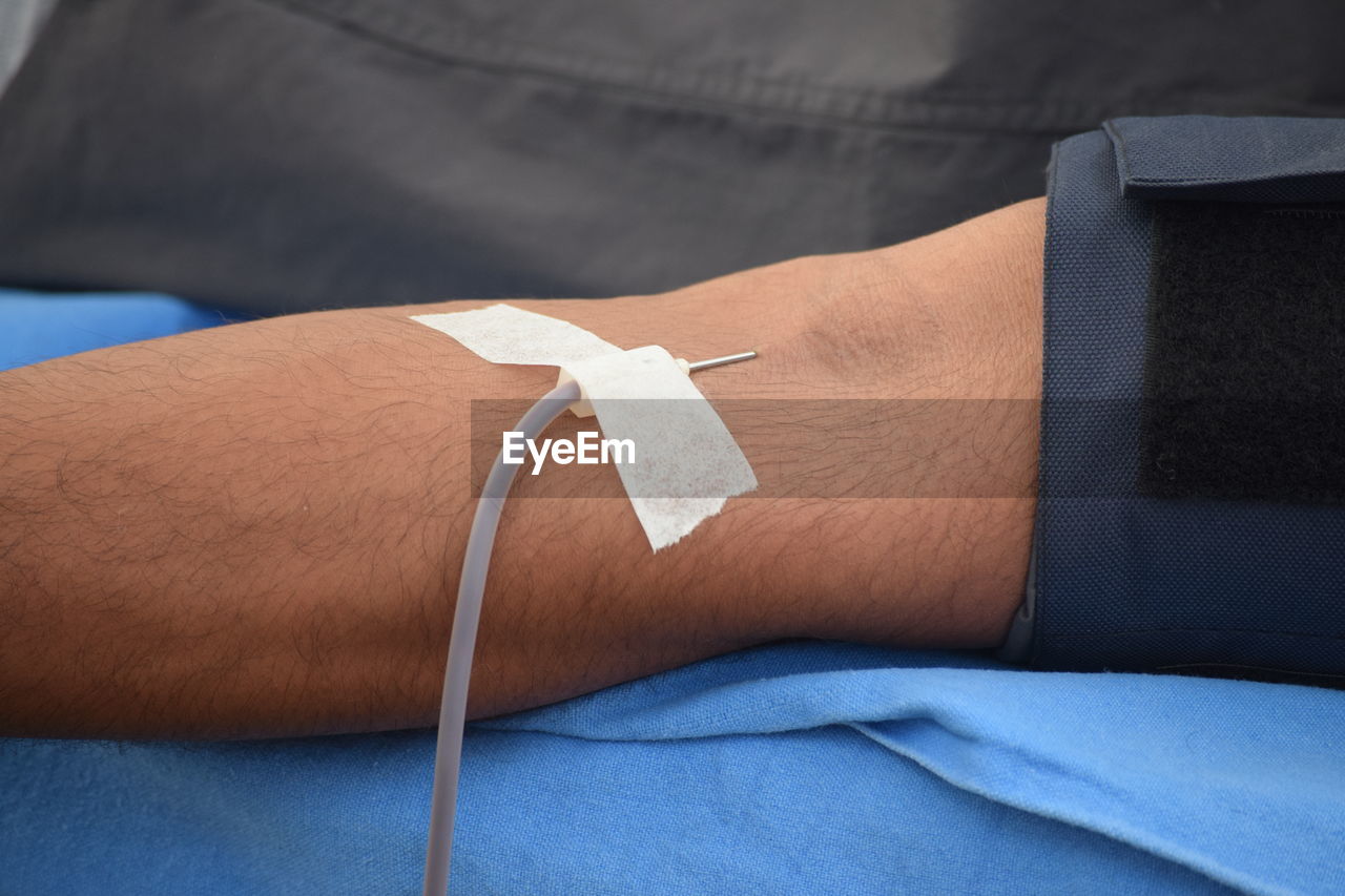 Close-up of man donating blood