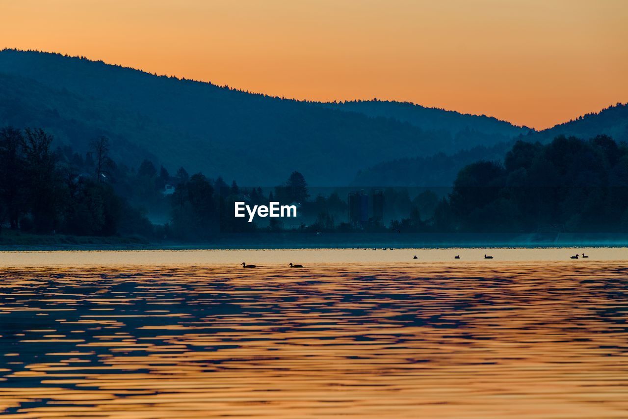 Scenic view of landscape against sky during sunset