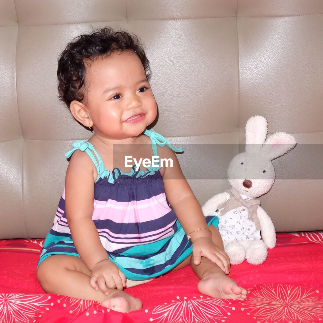 PORTRAIT OF CUTE GIRL WITH TOY