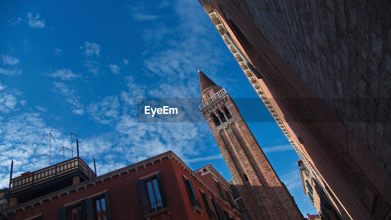 Low angle view of buildings against blue sky