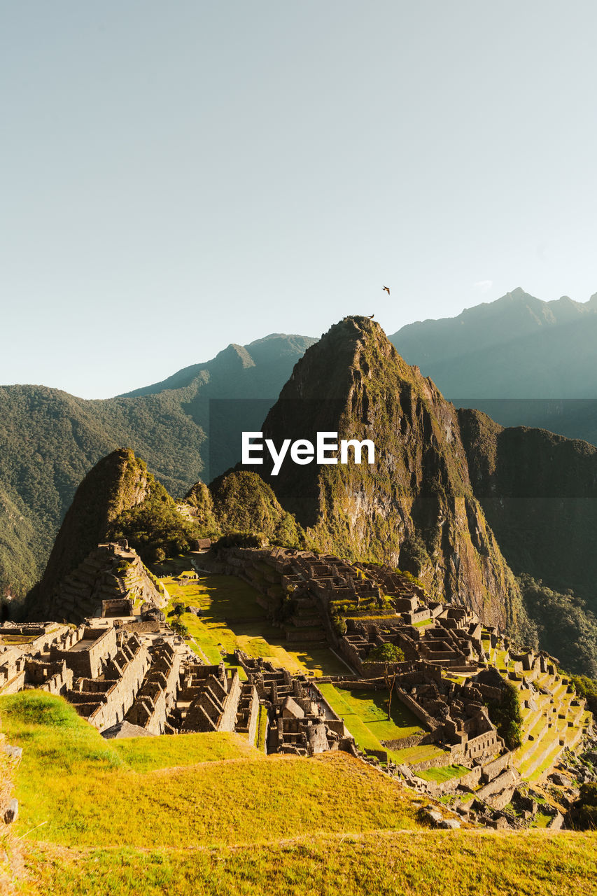 Machu picchu old inca ruins at sunrise in peru