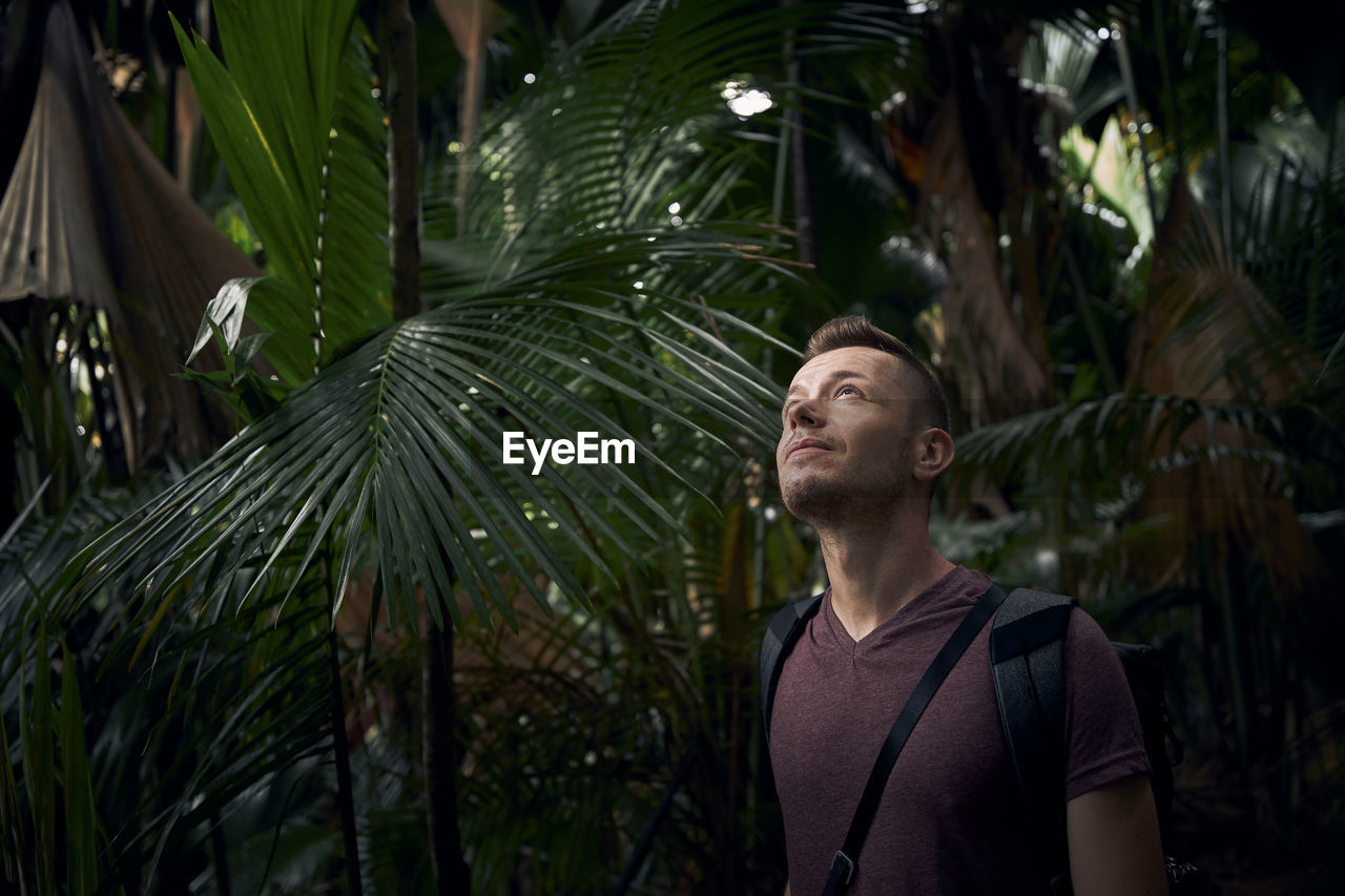 Young man looking away outdoors