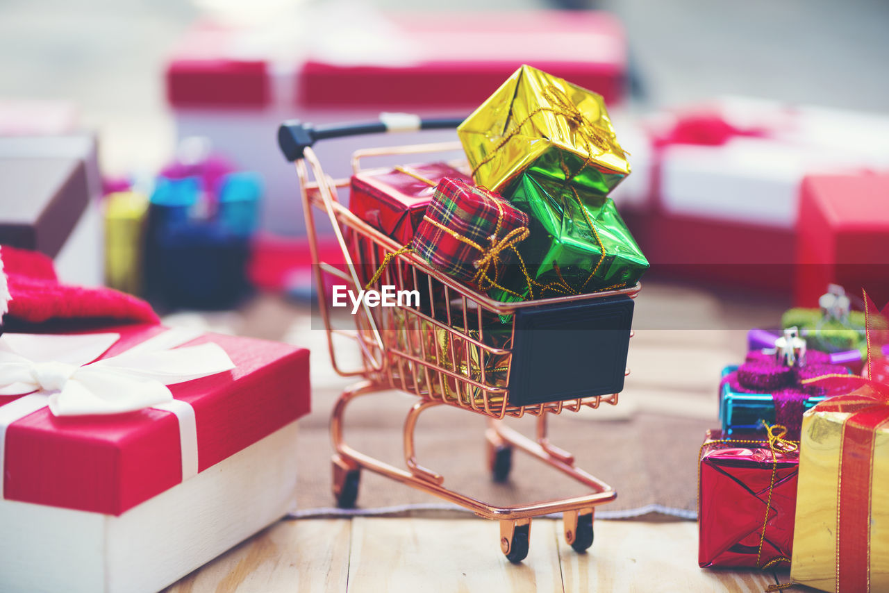 Close-up of multi colored gift box on table