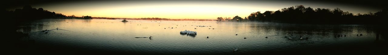 SCENIC VIEW OF LAKE AT SUNSET