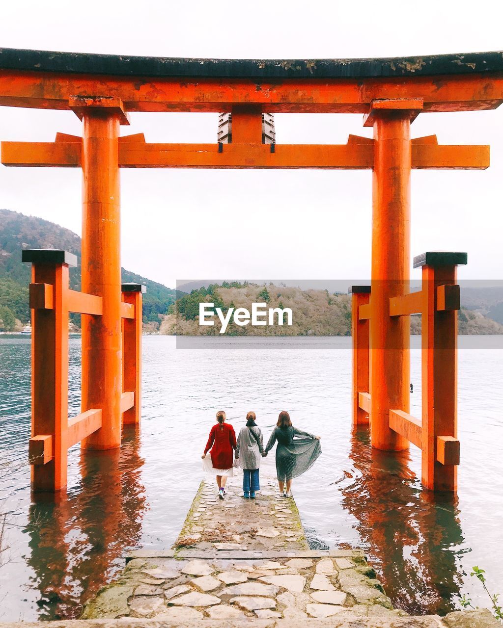 PEOPLE STANDING ON SHORE