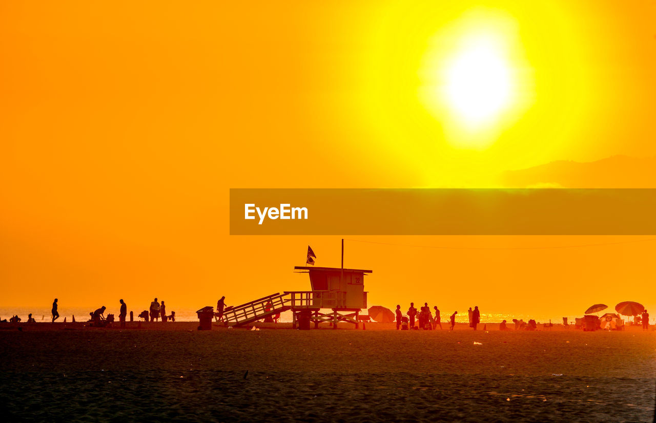 Silhouette of people on beach