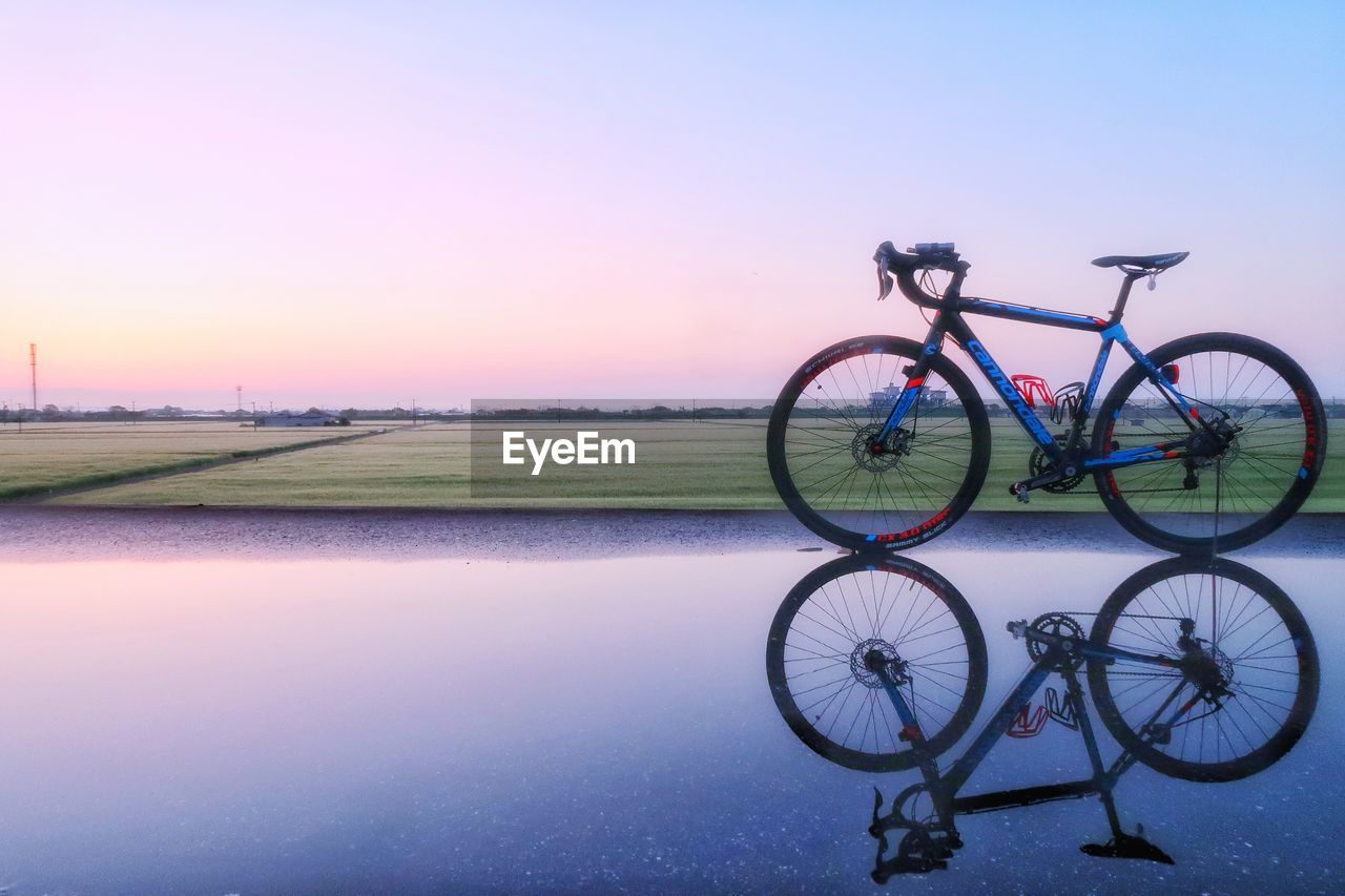 BICYCLE AGAINST SKY DURING SUNSET