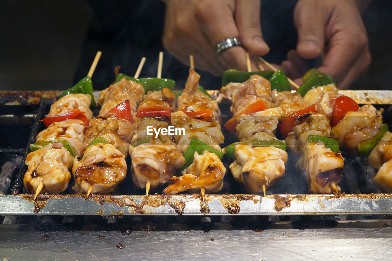 Close-up of man preparing food